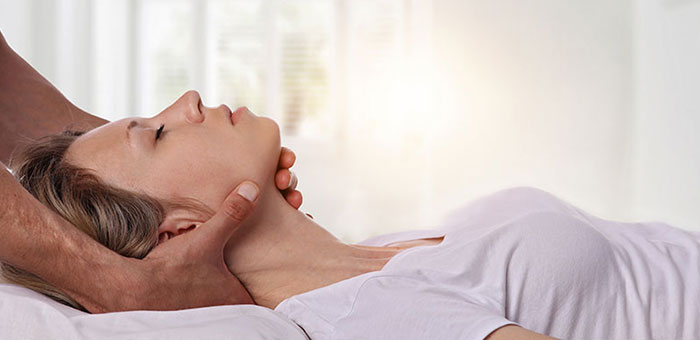 Woman receiving neck adjustment from Ohio chiropractor