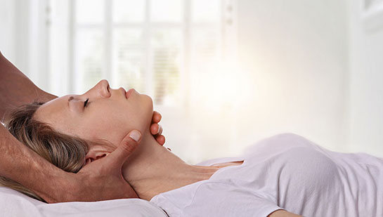 Woman receiving neck adjustment from Ohio chiropractor